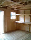 Workbench and shelves in a 12 ft wide workshop