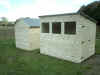 6 x 10 pent roof with 3 windows and door on right gable