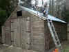 Hot felt seals being applied to an erected single garage